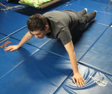 This older boy is able to use push-ups for heavy work