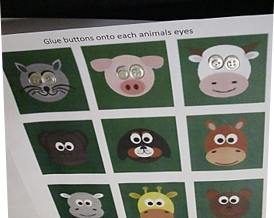 This photo shows how small buttons were glued for eyes onto the animal faces.