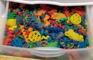 The photo below shows one drawer of a stacking tower filled with colored macaroni.  The macaroni shapes include wheels, spirals, shells and twists.  