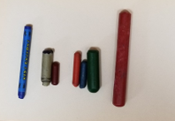 This photo below shows an assortment of crayons of varying lengths, widths, and textures.