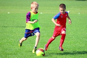Eye muscles guide the moves of the body and feet as these two players race to capture control of the soccer ball.