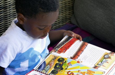 picture of a preschool child reading a book