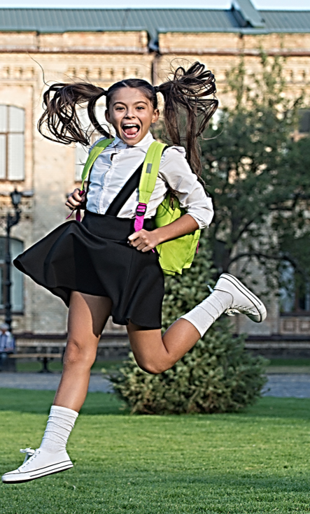 The girl shown in the photo is over-aroused to the extent that  her ponytails are flapping, facial expressions are exaggerated , and legs are in extreme patterns of motion. She is showing an excessive amount of energy.